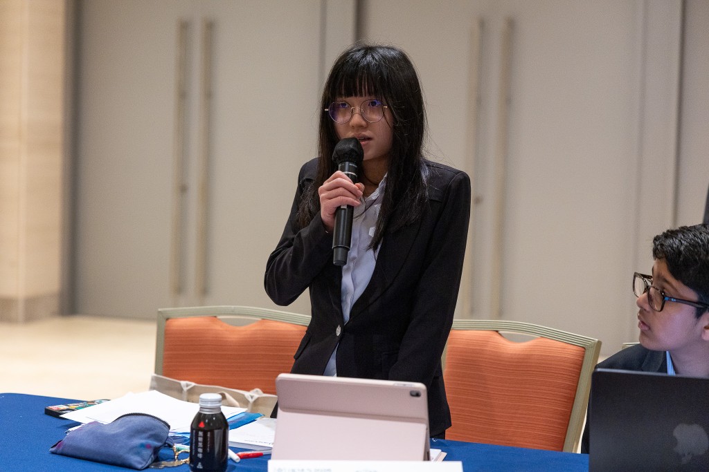 Student delegate speaking at conference